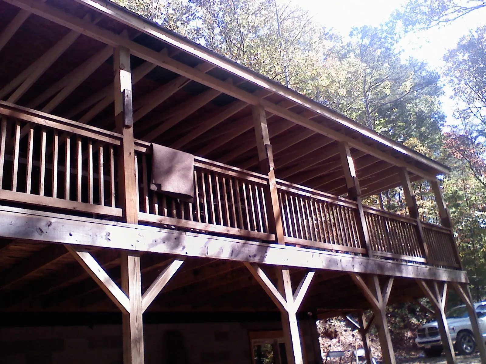 Timber framing under a new elevated porch and deck — Roof Leak Repair in Maceo by Roofing Brothers